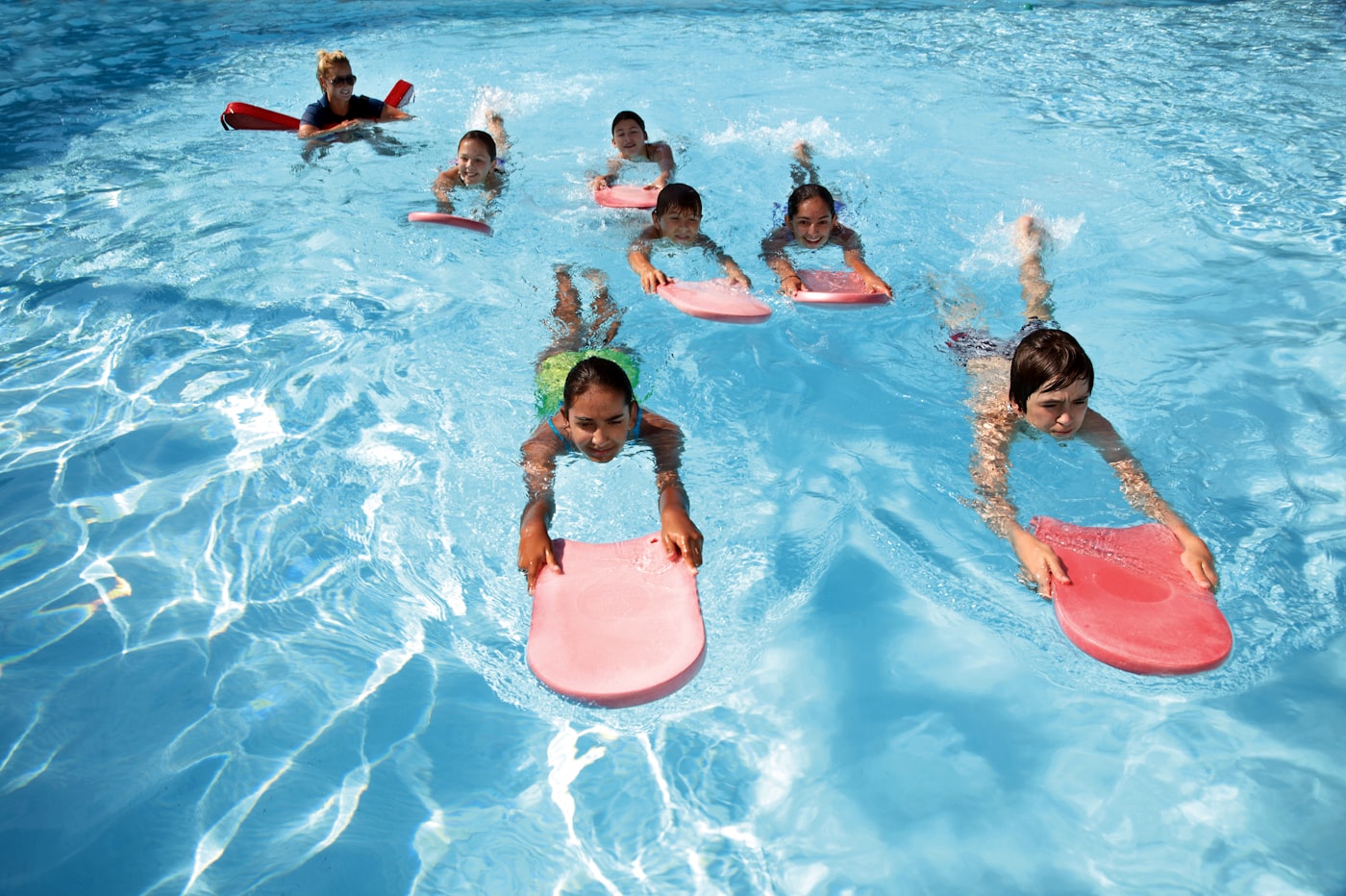Group swimming lesson at a community pool