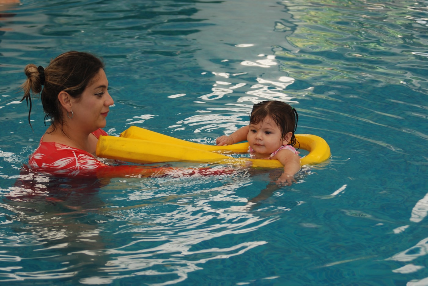 Infant swimming lesson in a pool